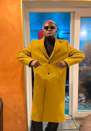 Mr. Jollof and others reacts to the video, "Is the make-up for me?" as Portable receives facials in preparation for his music video.