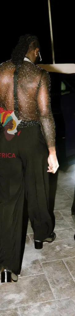 Burna Boy stirs up the crowd as he appears wearing heels