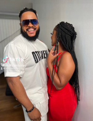 Whitemoney flaunts the woman in his life while Saga, Cross, and others react in the video.