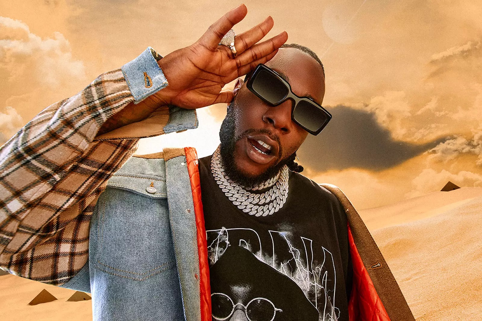 Burna Boy stirs up the crowd as he appears wearing heels