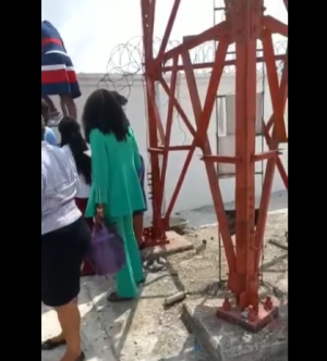 Viral video shows bank employees scaling a fence to avoid angry customers.